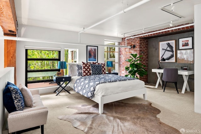 461 2nd St Unit C135, San Francisco, CA 94107 - bedroom with track lighting, carpet floors, and brick wall