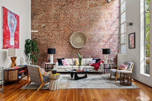 461 2nd St Unit C135, San Francisco, CA 94107 - living room with wood-type flooring and brick wall