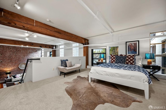 461 2nd St Unit C135, San Francisco, CA 94107 - carpeted bedroom featuring track lighting, brick wall, and beam ceiling
