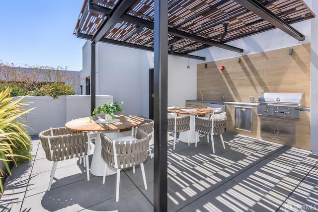 view of patio with exterior kitchen, outdoor dining space, area for grilling, and a pergola