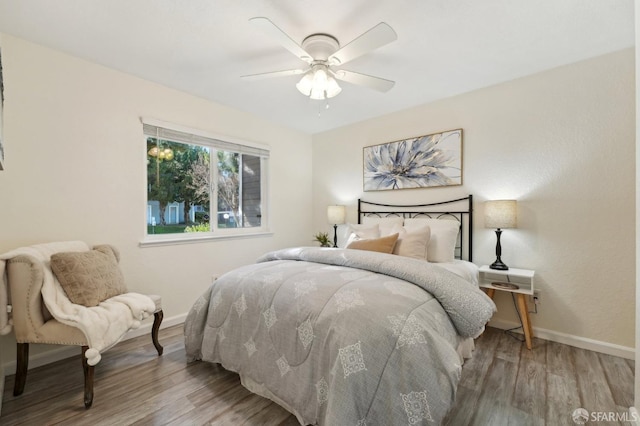 bedroom featuring ceiling fan and wood-type flooring