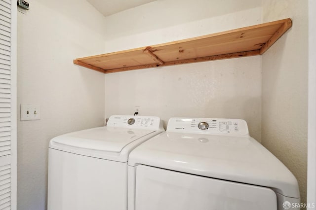 washroom with washer and dryer