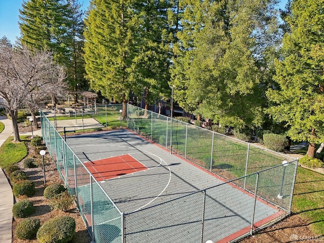 view of basketball court featuring tennis court