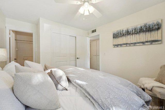 bedroom featuring ceiling fan and a closet