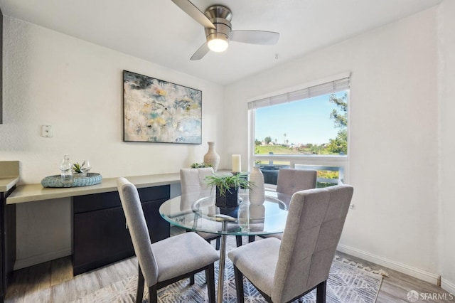 dining room featuring light wood-type flooring and ceiling fan