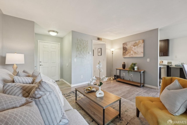 living room with light hardwood / wood-style flooring