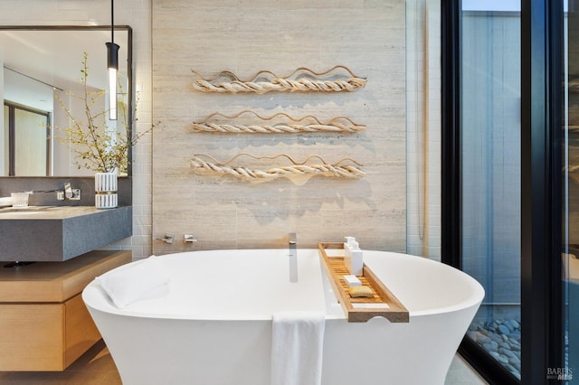 full bathroom with a freestanding bath