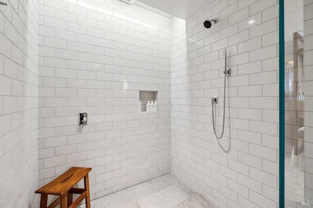 full bathroom with tiled shower