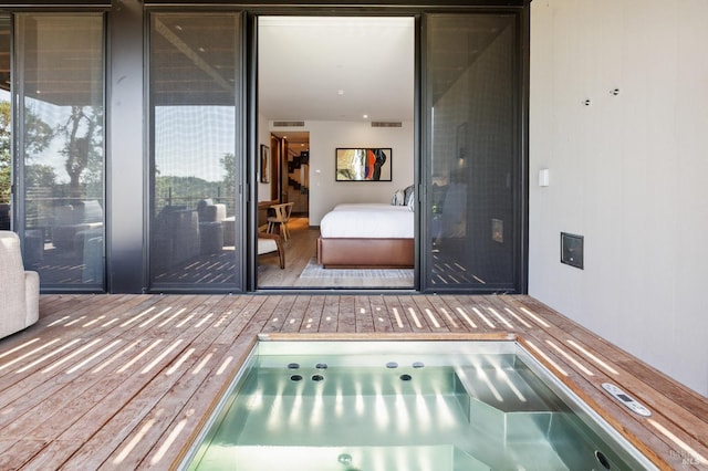 exterior space featuring wood finished floors and visible vents