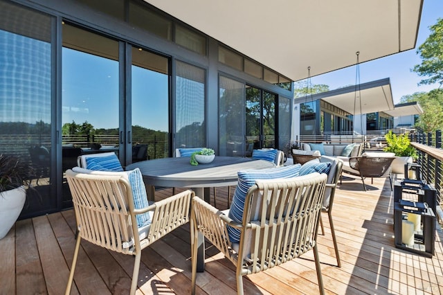 wooden deck featuring an outdoor hangout area