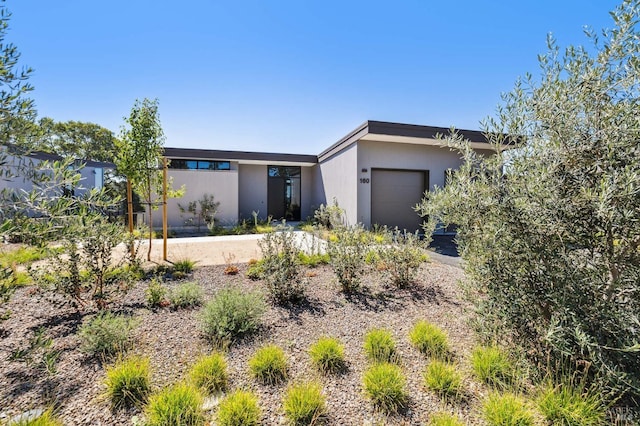 view of front of property featuring driveway and an attached garage
