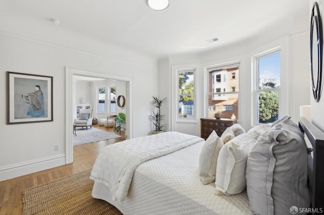 1015 Ashbury St Unit 3, San Francisco, CA 94117 - bedroom featuring multiple windows and light wood-style floors