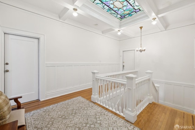 1015 Ashbury St Unit 3, San Francisco, CA 94117 - corridor featuring an upstairs landing, coffered ceiling, wood finished floors, beam ceiling, and a wainscoted wall