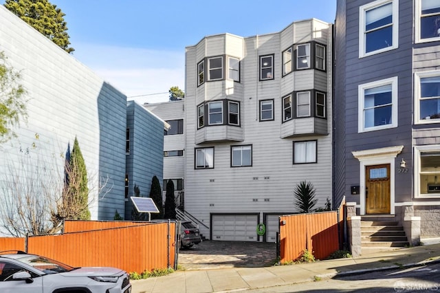 1015 Ashbury St Unit 3, San Francisco, CA 94117 - view of building exterior featuring entry steps and an attached garage