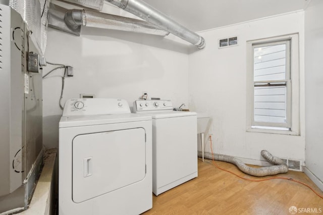1015 Ashbury St Unit 3, San Francisco, CA 94117 - laundry area with light wood-type flooring and separate washer and dryer