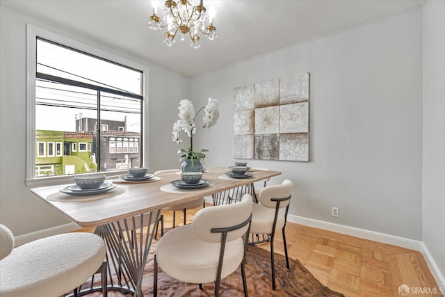 dining room with parquet floors and a notable chandelier