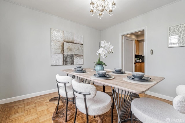 dining area with light parquet flooring and a chandelier