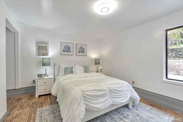 bedroom featuring dark hardwood / wood-style flooring