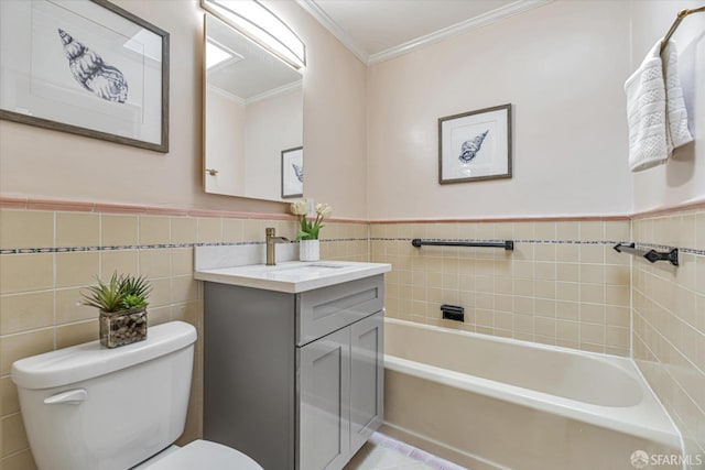 bathroom with tile walls, vanity, a washtub, toilet, and crown molding