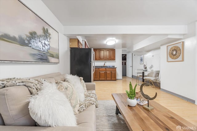 living room with light hardwood / wood-style flooring