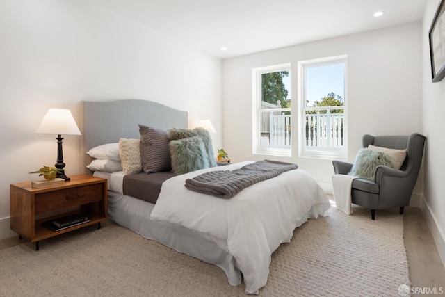 bedroom with light hardwood / wood-style floors