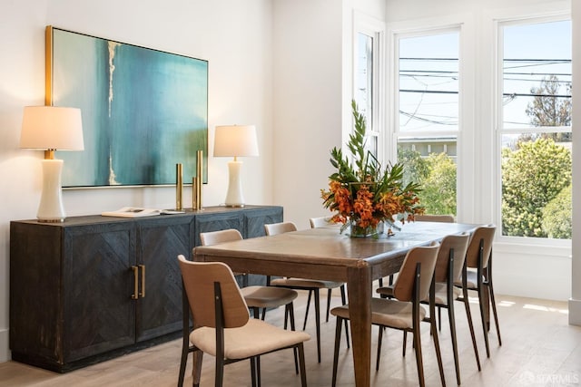 dining space with light wood-type flooring