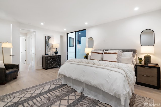 bedroom with light wood-type flooring