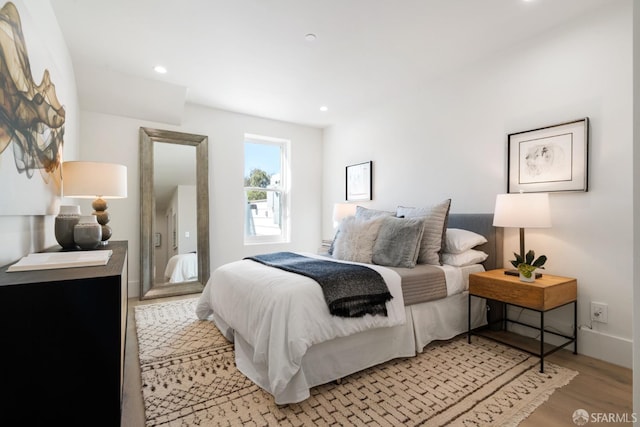 bedroom with light hardwood / wood-style floors