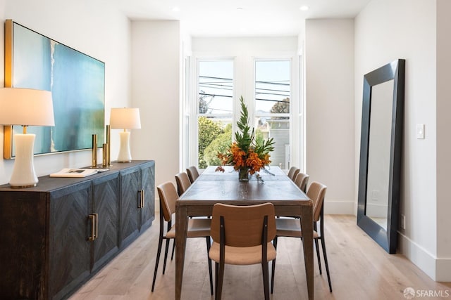 dining area with light wood-type flooring