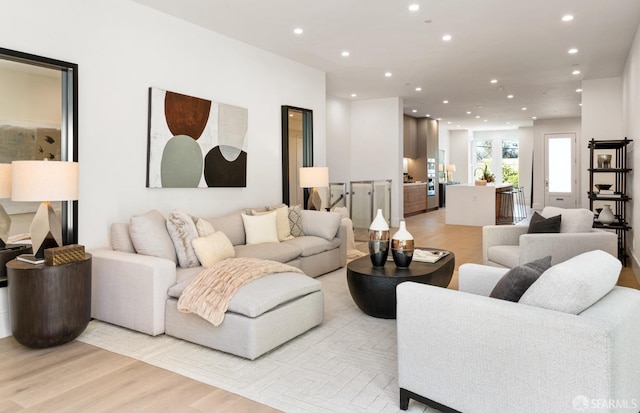 living room with light hardwood / wood-style flooring