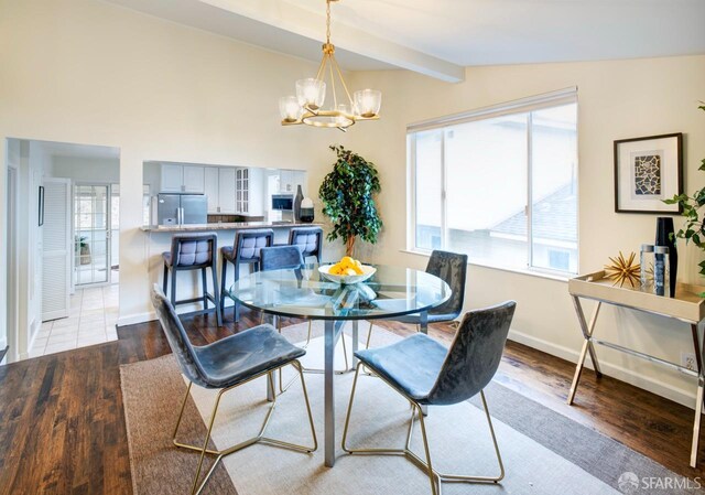 636 Edgemar Ave, Pacifica, CA 94044 - dining room featuring a chandelier, wood finished floors, and healthy amount of natural light
