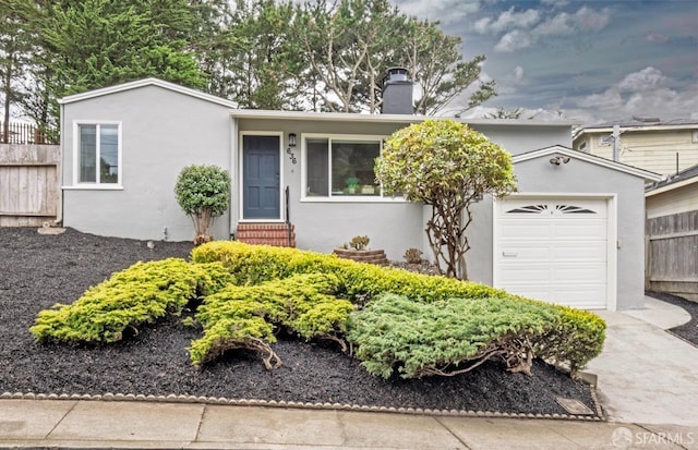 636 Edgemar Ave, Pacifica, CA 94044 - ranch-style house with a chimney, stucco siding, a garage, and entry steps