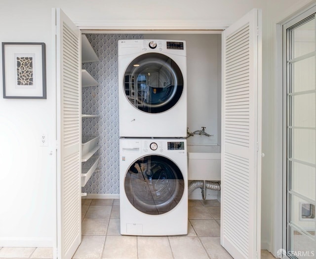 636 Edgemar Ave, Pacifica, CA 94044 - laundry area with stacked washer and clothes dryer, wallpapered walls, and tile patterned flooring