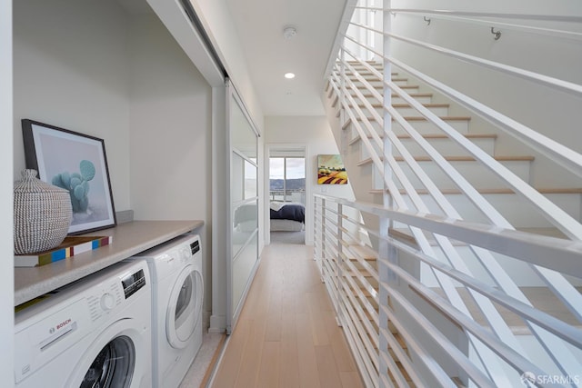 89 Kirkwood Ave, San Francisco, CA 94124 - laundry area featuring washing machine and clothes dryer, recessed lighting, and light wood-type flooring