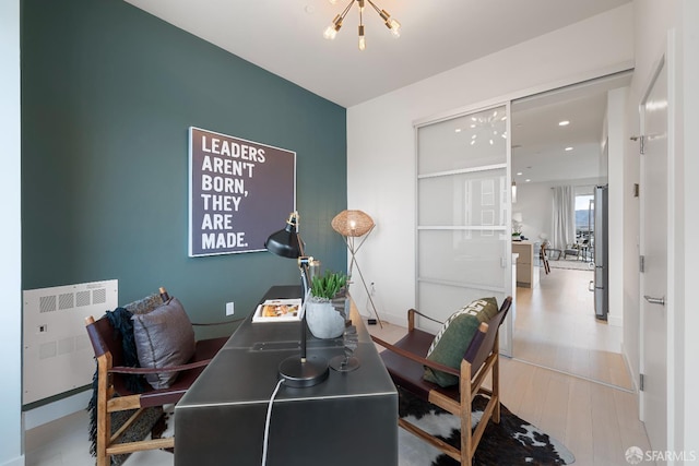 89 Kirkwood Ave, San Francisco, CA 94124 - office with a chandelier, recessed lighting, baseboards, wood finished floors, and radiator heating unit