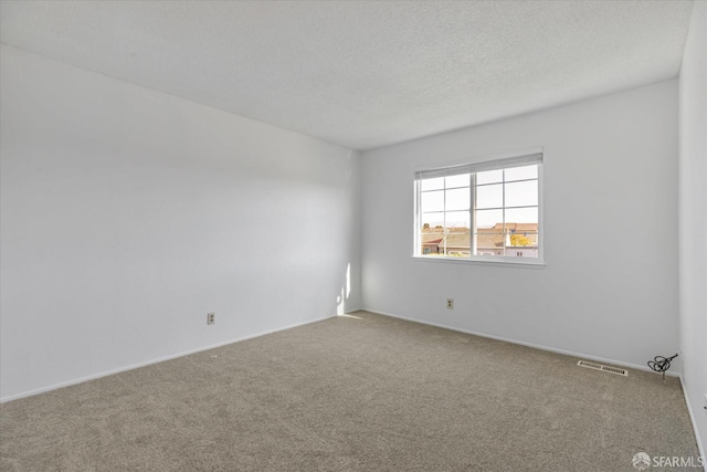 unfurnished room with carpet flooring