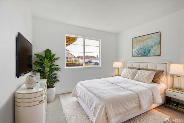 bedroom with light colored carpet