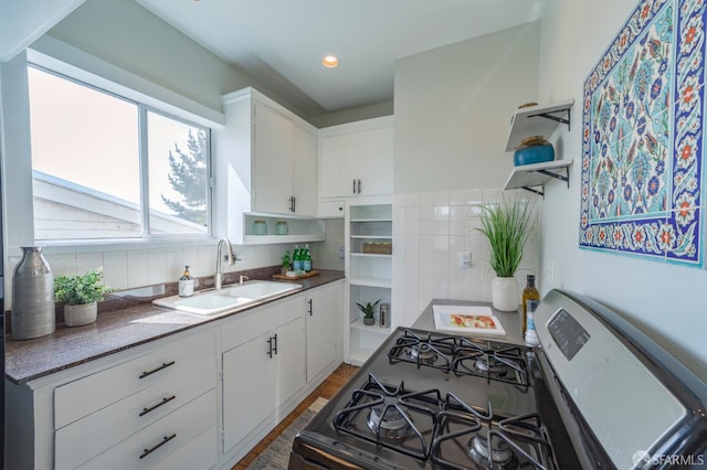 276 Bemis St, San Francisco, CA 94131 - kitchen featuring gas stove, open shelves, backsplash, white cabinets, and wood finished floors