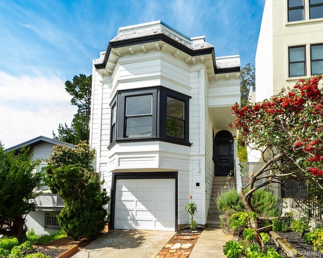 276 Bemis St, San Francisco, CA 94131 - view of front of house featuring an attached garage and concrete driveway
