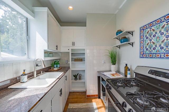 276 Bemis St, San Francisco, CA 94131 - kitchen featuring stainless steel range with gas stovetop, open shelves, white cabinets, wood finished floors, and tasteful backsplash