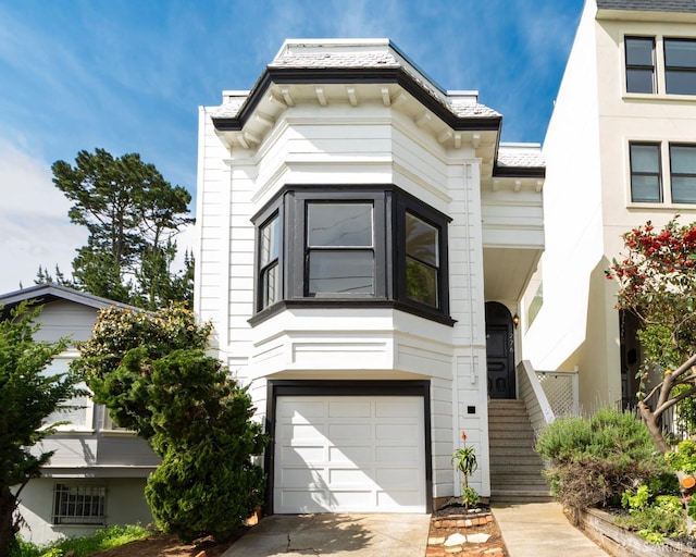 276 Bemis St, San Francisco, CA 94131 - view of front facade featuring a garage and concrete driveway