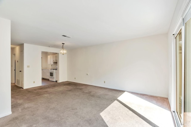 1285 Redwood Blvd Unit C, Novato, CA 94947 - unfurnished living room featuring a chandelier and light colored carpet