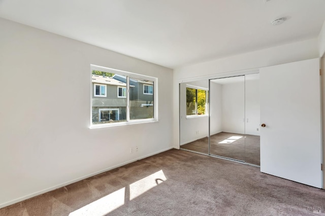 1285 Redwood Blvd Unit C, Novato, CA 94947 - unfurnished bedroom featuring carpet floors and a closet