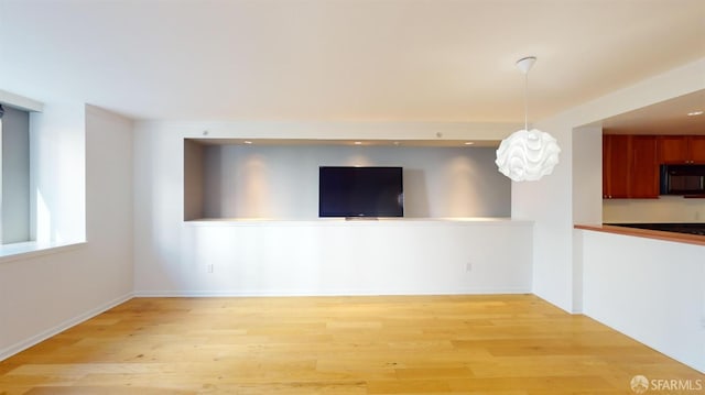 unfurnished living room featuring light hardwood / wood-style floors