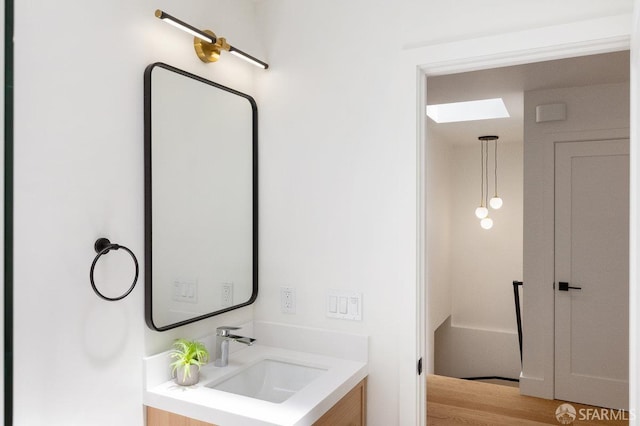 69 Lobos St, San Francisco, CA 94112 - bathroom with vanity and wood finished floors