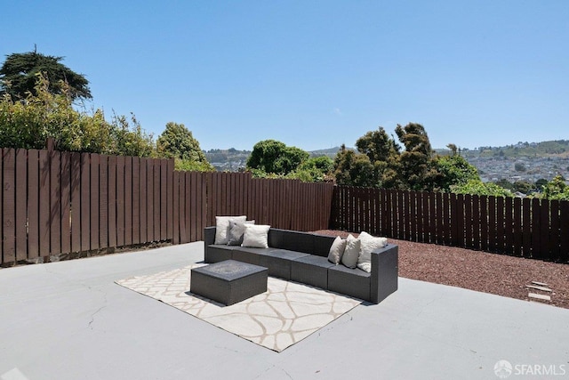 69 Lobos St, San Francisco, CA 94112 - fenced backyard featuring outdoor lounge area and a patio area