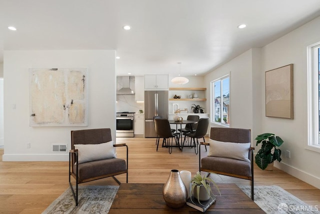 69 Lobos St, San Francisco, CA 94112 - living room with light wood-type flooring and recessed lighting