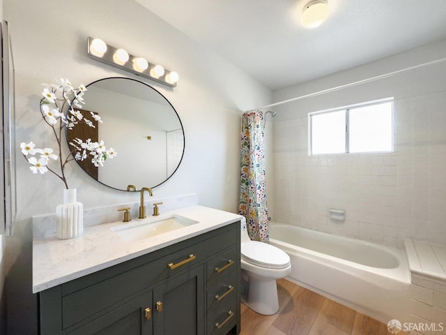 bathroom with vanity, toilet, shower / bath combo, and wood finished floors