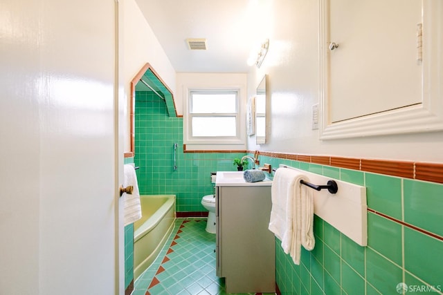 311 Linden Ave, San Bruno, CA 94066 - full bath featuring visible vents, tile walls, tile patterned floors, vanity, and toilet
