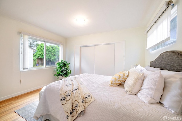 311 Linden Ave, San Bruno, CA 94066 - bedroom featuring baseboards, wood finished floors, and a closet